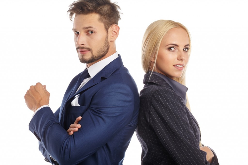 Young smiling business woman and business man isolated over white background